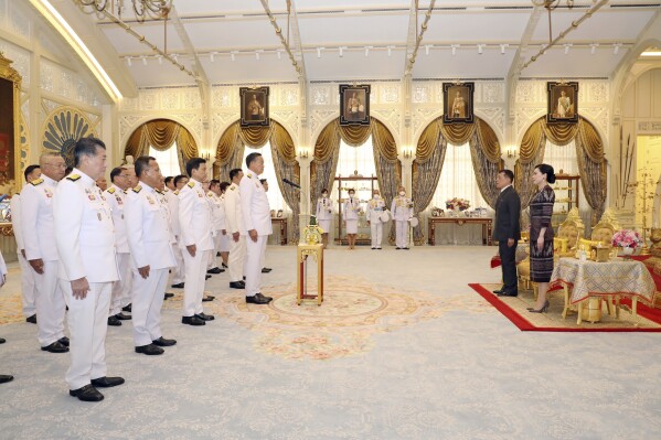 In this photo released by The Royal Household Bureau, Thailand's Prime Minister Srettha Thavisin leads, center, his cabinet members to take oath in front of Thailand's King Maha Vajiralongkorn, second right, and Thailand's Queen Suthida at Dusit Palace in Bangkok, Thailand, Tuesday, Sept. 5, 2023. (The Royal Household Bureau via AP)