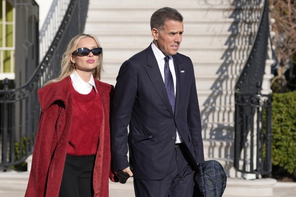 Hunter Biden and his wife Melissa Cohen Biden follow President Joe Biden and first lady Jill Biden as they walk to Marine One for departure from the South Lawn of the White House, Friday, Jan. 17, 2025, in Washington. (AP Photo/Alex Brandon)