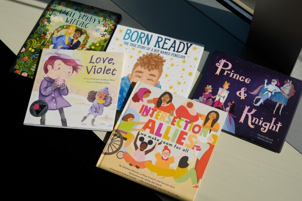 A selection of books featuring LGBTQ characters that are part of a Supreme Court case are pictured, Tuesday, April, 15, 2025, in Washington. (AP Photo/Pablo Martinez Monsivais)
