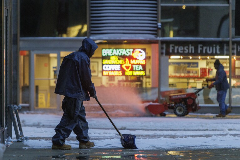 Workers remove snow from the plaza at 2 Penn Center in Center City Philadelphia, Tuesday morning Jan. 16, 2024. (Alejandro A. Alvarez/The Philadelphia Inquirer by the expend of AP)
