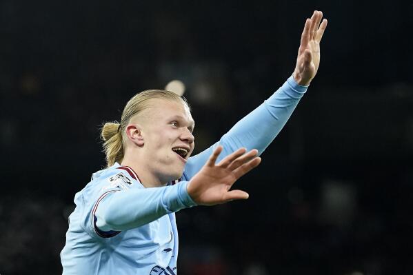 Manchester City's Erling Haaland reacts after he scored his 5th goal, the 6-0, during the Champions League round of 16 second leg soccer match between Manchester City and RB Leipzig at the Etihad stadium in Manchester, England, Tuesday, March 14, 2023. (AP Photo/Dave Thompson)