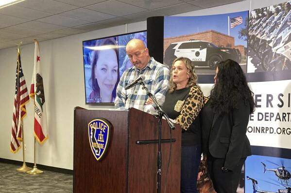 Michelle Blandin, center, daughter of Mark and Sharie Winek, speaks about her parents and sister, Brooke, who were killed during a news conference in Riverside, Calif., Wednesday, Nov. 30, 2022. Authorities are investigating whether a Virginia sheriff's deputy posed as a 17-year-old boy online to groom and sexually extort a teenage girl in California before driving across country and killing her mother and grandparents and setting fire to their home. "Nobody could imagine this crime happening to my family, to our family," said Blandin. (AP Photo/Amy Taxin)