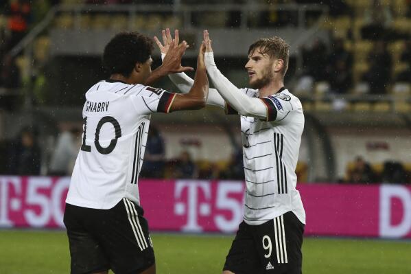 Germany's Timo Werner, right, reacts after scoring his side's second goal during the World Cup 2022 group J qualifying soccer match between North Macedonia and Germany at National Arena Todor Proeski stadium in Skopje, North Macedonia, Monday, Oct. 11, 2021. (AP Photo/Boris Grdanoski)