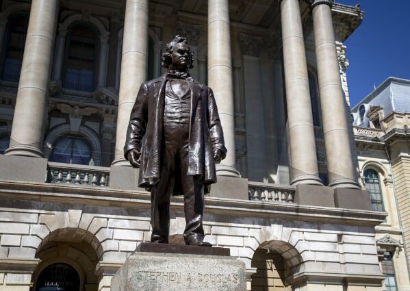 FILE - In this Aug. 19, 2020 file photo, a statue of Stephen Douglas stands in front of the east entrance to the Illinois State Capitol, in Springfield, Ill. Illinois officials approved the removal of the statue of the 19th century senator from Illinois who owned slaves and espoused the notion that each territory should decide whether slavery would be allowed. (Justin L. Fowler/The State Journal-Register via AP File)/The State Journal-Register via AP)