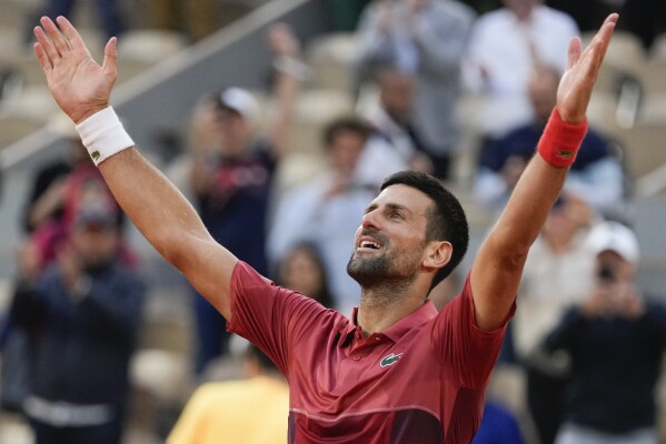 Serbia's Novak Djokovic celebrates winning his fourth round match of the French Open tennis tournament against Argentina's Francisco Cerundolo at the Roland Garros stadium in Paris, Monday, June 3, 2024. (AP Photo/Thibault Camus)