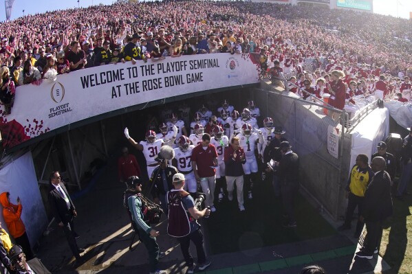 Alabama head coach Nick Saban leads his team on to the field before the Rose Bowl CFP NCAA semifinal college football game against Michigan, Monday, Jan. 1, 2024, in Pasadena, Calif. (AP Photo/Mark J. Terrill)