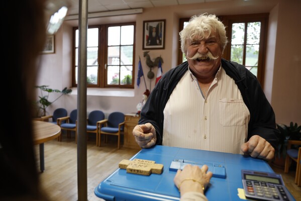 Walter Sylvain reacts after voting in Soultz-Les-Bains, eastern France, Sunday, June 30, 2024. (AP Photo/Jean-Francois Badias)
