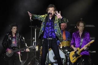 FILE - In this Aug. 22, 2019 file photo, Mick Jagger, center, performs with his Rolling Stones bandmates, from left, Ron Wood, Charlie Watts and Keith Richards during their concert at the Rose Bowl in Pasadena, Calif.  The Stones announced Thursday, July 22, 2021, that they will relaunch their U.S. tour on Sept. 26 in St. Louis. Their revived tour will include some new dates in Los Angeles, Las Vegas and a show at the New Orleans Jazz and Heritage Festival.  (Photo by Chris Pizzello/Invision/AP, File)