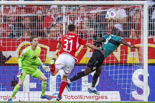 Serhou Guirassy of VfB Stuttgart scores his side's first goal during the Bundesliga soccer match between Union Berlin and VfB Stuttgart in Berlin Saturday, Oct. 21, 2023. (Andreas Gora/dpa via AP)