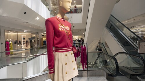 An outfit that is part of the Balmain x Barbie collection is seen on display at Neiman Marcus in Beverly Hills, Calif., on Wednesday, July 19, 2023. The store launched its exclusive Barbie collaboration with Balmain last year and sold out of many items in the first few days.  Based on the success of last year's collaboration and the current Barbiecore cultural phenomenon, the collection has been reissued on Monday.  (AP Photo/Richard Vogel)