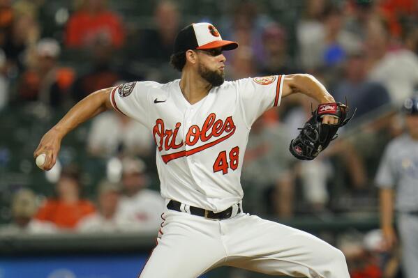 Baltimore Orioles relief pitcher Jorge Lopez throws a pitch to the Tampa Bay Rays during the 10th inning of a baseball game, Wednesday, July 27, 2022, in Baltimore. The Rays won 6-4 in ten innings. (AP Photo/Julio Cortez)