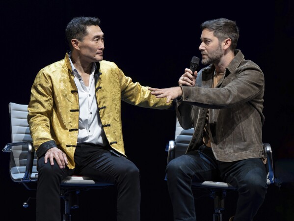 This image released by Polk & Co. shows Daniel Dae Kim, left, and Ryan Eggold during a performance of "Yellow Face on Broadway," a play by David Henry Hwang, in New York. (Joan Marcus/Polk & Co. via AP)
