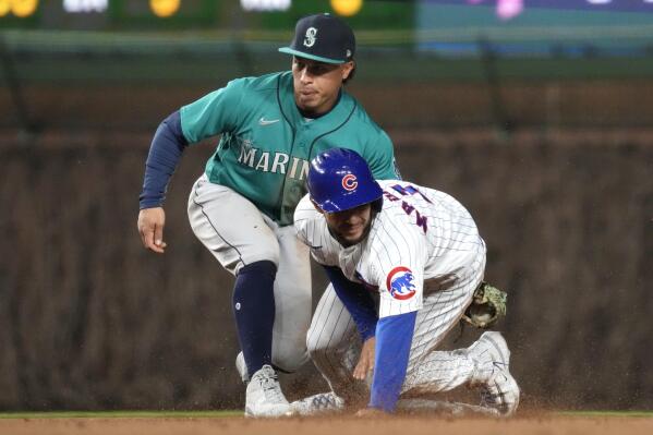 Velázquez hits grand slam as Cubs rally past Mariners 14-9