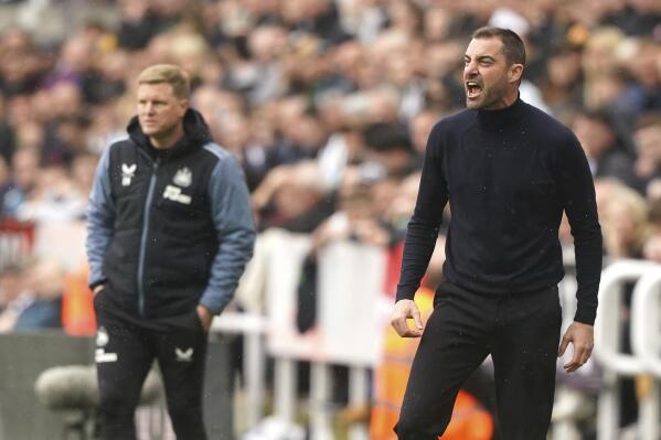 Southampton manager Ruben Selles, right, and Newcastle United manager Eddie Howe look on during the English Premier League soccer match between Newcastle United and Southampton at St James' Park, Newcastle upon Tyne, England, Sunday, April 30, 2023. (Owen Humphreys/PA via AP)