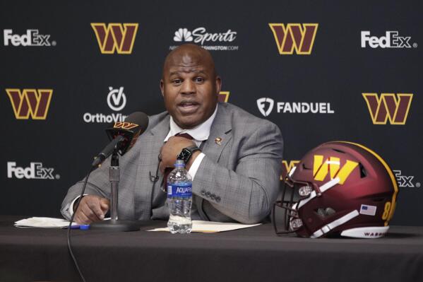 Eric Bieniemy talks after being introduced as the new offensive coordinator and assistant head coach of the Washington Commanders during an NFL football press conference in Ashburn, Va., Thursday, Feb. 23, 2023. (AP Photo/Luis M. Alvarez)