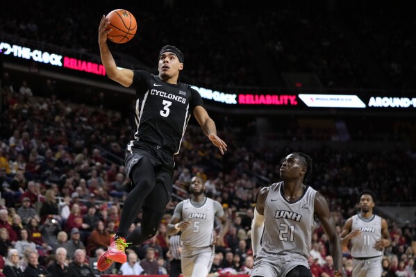 Iowa State guard Tamin Lipsey (3) drives to the basket past New Hampshire forward Clarence Daniels (21) during the second half of an NCAA college basketball game, Sunday, Dec. 31, 2023, in Ames, Iowa. Iowa State won 85-70. (AP Photo/Charlie Neibergall)