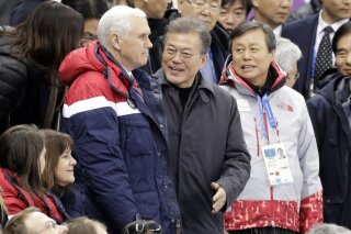 
              United States' Vice President Mike Pence, centre left and South Korean President Moon Jae-in attend the ladies' 500 meters short-track speedskating in the Gangneung Ice Arena at the 2018 Winter Olympics in Gangneung, South Korea, Saturday, Feb. 10, 2018. (AP Photo/Bernat Armangue)
            