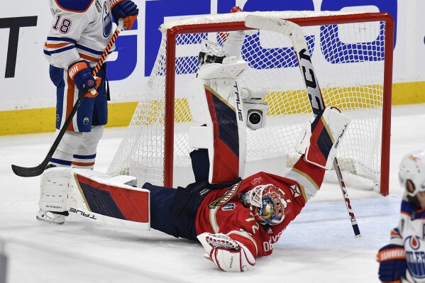 Florida Panthers goaltender Sergei Bobrovsky falls to the ice during the second period of Game 1 of the NHL hockey Stanley Cup Finals Edmonton Oilers Saturday, June 8, 2024, in Sunrise, Fla. (AP Photo/Michael Laughlin)