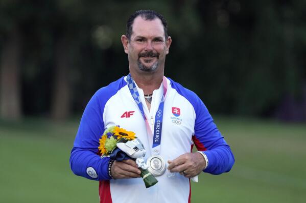 Silver medal winner Rory Sabbatini, of Slovakia, stands on the podium after the men's golf event at the 2020 Summer Olympics, Sunday, Aug. 1, 2021, at the Kasumigaseki Country Club in Kawagoe, Japan, (AP Photo/Andy Wong)