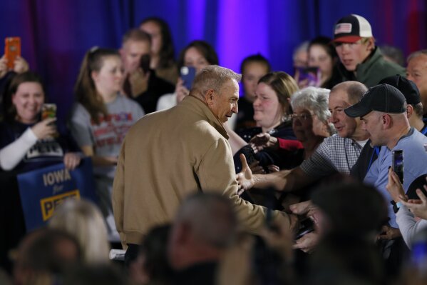 Actor Kevin Costner greets audience members after speaking at a campaign rally for Democratic presidential candidate South Bend, Ind., Mayor Pete Buttigieg, Sunday, Dec. 22, 2019, in Indianola, Iowa. Costner endorsed Buttigieg's candidacy at the event. (AP Photo/Charlie Neibergall)
