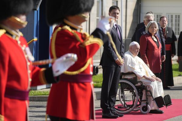 Pope Francis is flanked by Canadian Prime Minister Justin Trudeau, left, and Governor-General Mary Simon, upon his arrival at the Citadelle de Quebec, Wednesday, July 27, 2022. Pope Francis is on a "penitential" six-day visit to Canada to beg forgiveness from survivors of the country's residential schools, where Catholic missionaries contributed to the "cultural genocide" of generations of Indigenous children by trying to stamp out their languages, cultures and traditions. (AP Photo/Gregorio Borgia)