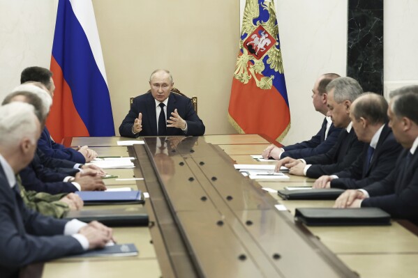 Russian President Vladimir Putin chairs a meeting with the heads of Russian law enforcement agencies at the Kremlin in Moscow, Russia, Monday, June 26, 2023. (Valery Sharifulin, Sputnik, Kremlin Pool Photo via AP)