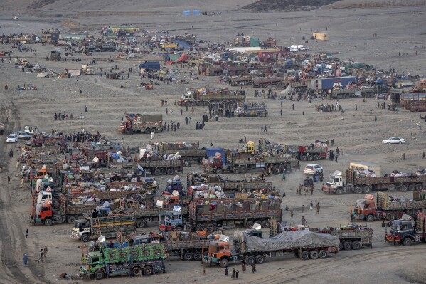 FILE- Afghan refugees settle in a camp near the Torkham Pakistan-Afghanistan border, in Torkham, Afghanistan, Friday, Nov. 3, 2023. The Taliban says Pakistan has effectively closed a key northwestern border crossing with Afghanistan to truck drivers. Pakistani authorities began requesting passports and visas from Afghan drivers, according to a Taliban official. (AP Photo/Ebrahim Noroozi, File)