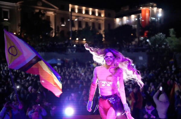 A trans artist, performs during a Gay Pride parade marking the culmination of LGBTQ+ Pride month, in Asuncion, Paraguay, Saturday, June 29, 2024. (AP Photo/Jorge Saenz)