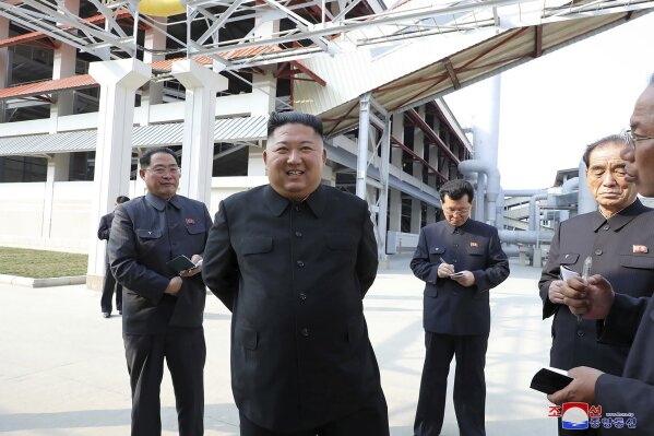 ADDING CITY - In this Friday, May 1, 2020, photo provided by the North Korean government, North Korean leader Kim Jong Un, center, visits a fertilizer factory in Sunchon, South Pyongan province, near Pyongyang, North Korea. Kim made his first public appearance in 20 days as he celebrated the completion of the fertilizer factory, state media said Saturday, May 2, 2020, ending an absence that had triggered global rumors that he may be seriously ill.  Independent journalists were not given access to cover the event depicted in this image distributed by the North Korean government. The content of this image is as provided and cannot be independently verified. Korean language watermark on image as provided by source reads: "KCNA" which is the abbreviation for Korean Central News Agency. (Korean Central News Agency/Korea News Service via AP)