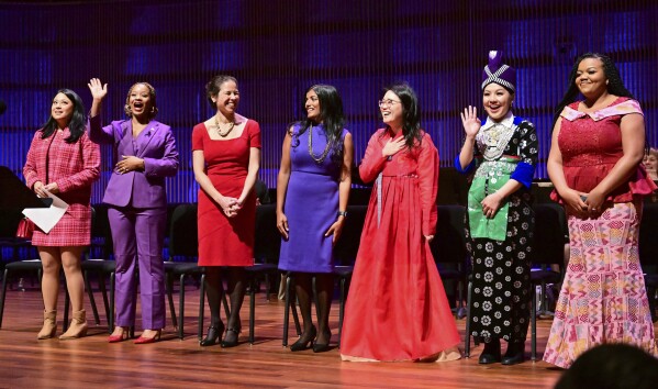 St. Paul City Council members, from left, Mitra Jalali, Anika Bowie, Rebecca Noecker, Saura Jost, HwaJeong Kim, Nelsie Yang and Chenique Johnson are introduced at the start of the inauguration ceremony for St. Paul City Council members in St. Paul, Minn. on Tuesday, Jan. 9, 2024. The youngest and most diverse city council in the history of Minnesota's capital city was sworn into office Tuesday, officially elevating the first all-female St. Paul City Council into public service at City Hall. (John Autey /Pioneer Press via AP)