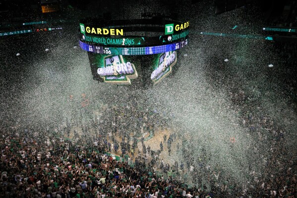 Confetti falls after the Boston Celtics beat the Dallas Mavericks in Game 5 of the NBA basketball finals, Monday, June 17, 2024, in Boston.  (AP Photo/Michael Dwyer)