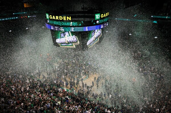 Confetti falls after the Boston Celtics defeated the Dallas Mavericks in Game 5 of the NBA basketball finals, Monday, June 17, 2024, in Boston. (AP Photo/Michael Dwyer)