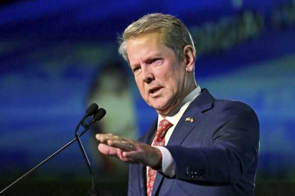 Georgia Gov. Brian Kemp speaks during Georgia Chamber Congressional Luncheon at The Classic Center, Tuesday, Aug. 8, 2023, in Athens, Ga. Figures show a health plan for low-income adults backed by the Republican Kemp enrolled only 1,343 people through its first three months.(Hyosub Shin/Atlanta Journal-Constitution via AP, File)