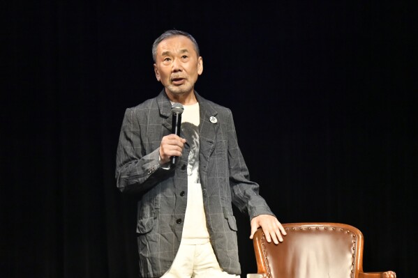 In this photo provided by The Waseda International House of Literature, Japanese novelist Haruki Murakami speaks during a ghost story reading event in Tokyo, Thursday, Sept. 28, 2023. Murakami hosted the event amid growing attention before the announcement of this year's Nobel Prize in literature, an award he is a perennial favorite to win. (The Waseda International House of Literature via AP)