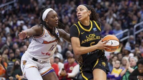 FILE - Los Angeles Sparks forward Dearica Hamby (5) drives to the basket while being guarded by Phoenix Mercury forward Michaela Onyenwere (12) during a WNBA basketball game May 19, 2023, in Los Angeles. Recent allegations by Hamby that her coach harassed her for being pregnant have shined a renewed spotlight on one of the biggest challenges that female professional athletes face. The athletes say that pregnant athletes continue to encounter attitudes ranging from ambivalent to outright hostile from leagues, coaches — and even fellow players. (AP Photo/Jeff Lewis, File)