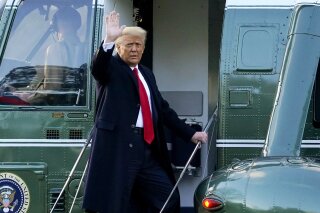 FILE - In this Wednesday, Jan. 20, 2021, file photo, President Donald Trump waves as he boards Marine One on the South Lawn of the White House, in Washington, en route to his Mar-a-Lago Florida Resort. Three months after former President Trump helped incite a violent attack against Congress, the GOP is bringing hundreds of donors and several future presidential prospects to the former president's doorstep in south Florida. (AP Photo/Alex Brandon, File)