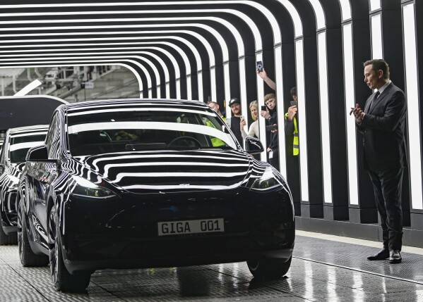 Tesla CEO Elon Musk claps hands at the opening of the Tesla factory Berlin Brandenburg in Gruenheide, Germany, Tuesday, March 22, 2022. (Patrick Pleul/Pool Photo via AP, File)