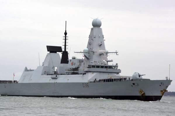 FILE - This March 20, 2020 file photo shows HMS Defender in Portsmouth, England. The Russian military says its warship has fired warning shots and a warplane dropped bombs to force the British destroyer from Russia's waters near Crimea in the Black Sea. The incident on Wednesday June 23, 2021, marks the first time since the Cold War era when Moscow used live ammunition to deter a NATO warship, reflecting soaring Russia-West tensions. (Ben Mitchell/PA via AP, File)