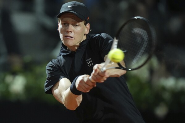 Italy's Jannik Sinner returns a shot during a round of sixteen match against Argentina's Francisco Cerundolo at the Italian Open tennis tournament in Rome, Tuesday, May 13, 2025. (AP Photo/Andrew Medichini)