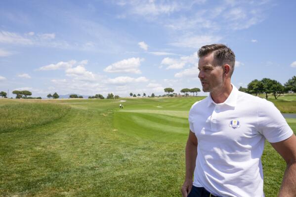2023 Europe Ryder Cup golf captain Henrik Stenson walks on the green of the Marco Simone golf club, at the end of a press conference, in Guidonia Montecelio, outskirts of Rome, Monday, May 30, 2022. The Marco Simone club will be hosting the 2023 edition of the Ryder Cup. (AP Photo/Andrew Medichini)