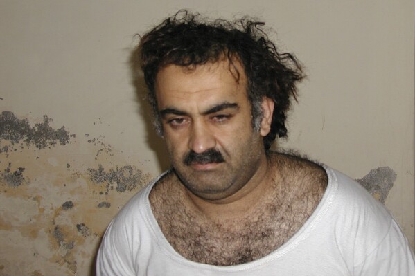 FILE - This Saturday March 1, 2003, photo obtained by The Associated Press shows Khalid Shaikh Mohammad, the alleged Sept. 11 mastermind, shortly after his capture during a raid in Pakistan. The suspected architect of the Sept. 11, 2001, attacks and his fellow defendants may never face the death penalty under plea agreements now under consideration to bring an end to their more than decadelong prosecution, the Pentagon and FBI have advised families of some of the thousands killed. (AP Photo)