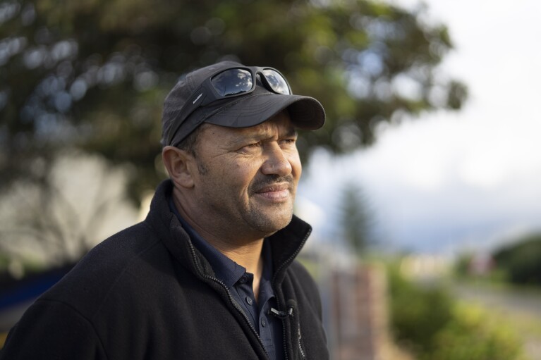 Raphael Fisher poses outside his home in Hawston, South Africa, April 27, 2023.  (AP Photo/Jerome Delay)