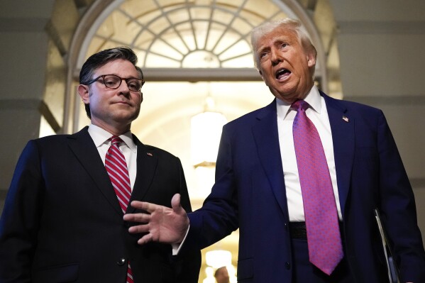 Speaker of the House Mike Johnson, R-La., and President Donald Trump arrive for a House Republican conference meeting, Tuesday, May 20, 2025, at the U.S. Capitol in Washington. (AP Photo/Julia Demaree Nikhinson)