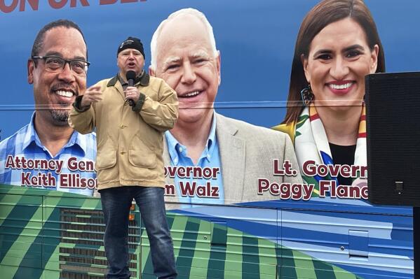 Democratic Minnesota Gov. Tim Walz rallies supporters on Friday, Nov. 4, 2022, outside the State Capitol in St. Paul, Minn. Both Walz and Republican challenger Scott Jensen held Capitol rallies as they launched their final sprints to Election Day. (AP Photo/Steve Karnowski)