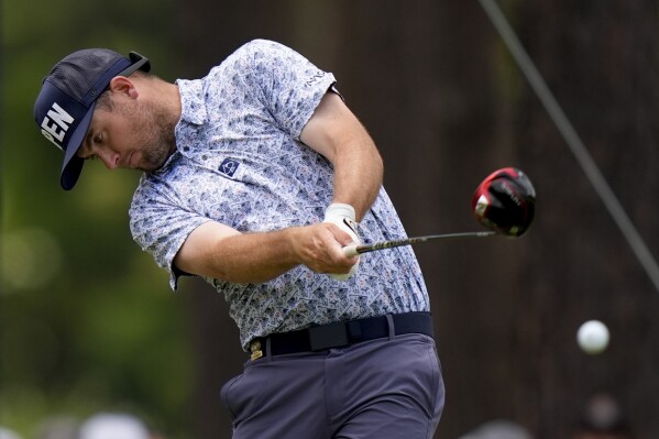 Colin Prater hits his tee shot on the 10th hole during a practice round for the U.S. Open golf tournament Wednesday, June 12, 2024, in Pinehurst, N.C. (AP Photo/Frank Franklin II)