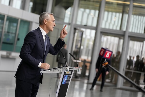NATO Secretary General Jens Stoltenberg speaks with the media as he arrives for a meeting of NATO foreign ministers at NATO headquarters in Brussels, Wednesday, April 3, 2024. NATO foreign ministers gathered in Brussels on Wednesday to debate plans to provide more predictable, longer-term support to Ukraine. (AP Photo/Virginia Mayo)