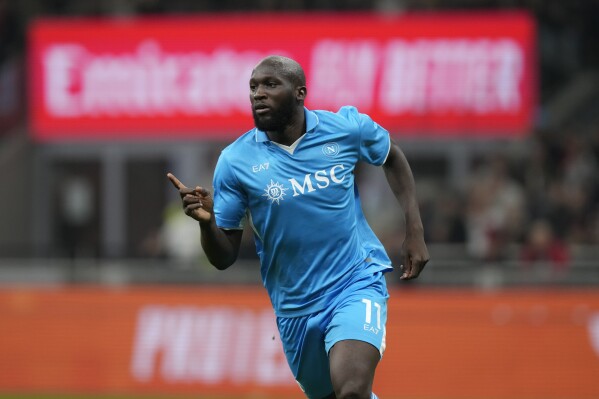 Napoli's Romelu Lukaku celebrates after scoring his side's opening goal during the Serie A soccer match between AC Milan and Napoli at the San Siro stadium, in Milan, Italy, Tuesday, Oct. 29, 2024. (AP Photo/Luca Bruno)