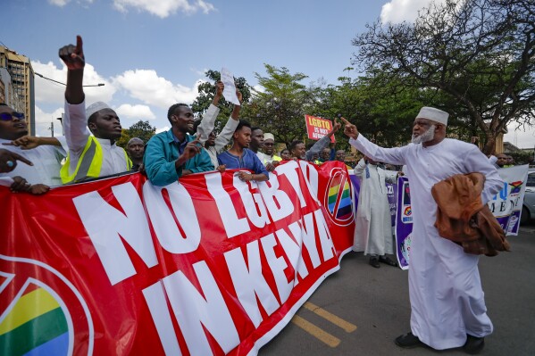 People hold placards as they chant slogan during a protest against a ruling by the Kenya supreme court for upholding the National Gay and Lesbian Human Rights Commission (NGLHRC) to register the association in Nairobi, Friday Oct. 6 2023. The protests took place after the Friday prayers with demonstrator’s calling out Kenya’s highest court for “condoning immorality.” (AP Photo/Brian Inganga)