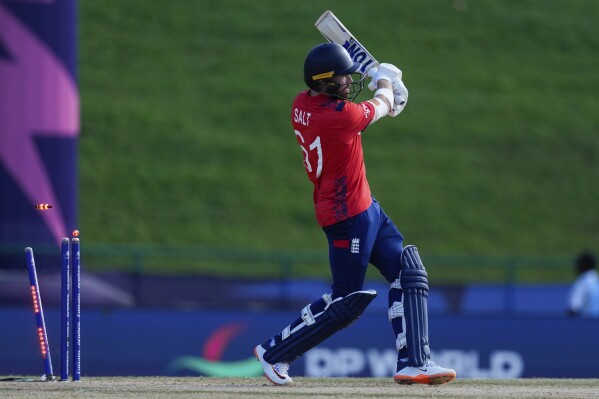 England's Phil Salt is bowled by Oman's Bilal Khan for 12 runs during an ICC Men's T20 World Cup cricket match at Sir Vivian Richards Stadium in North Sound, Antigua and Barbuda, Thursday, June 13, 2024. (AP Photo/Ricardo Mazalan)