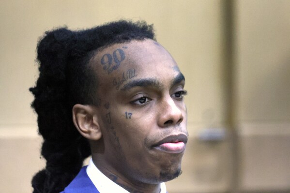 FILE - Jamell Demons, also known as rapper YNW Melly, waits in the courtroom for a question from the jury as they deliberate at the Broward County Courthouse in Fort Lauderdale, Fla., on Saturday, July 22, 2023. Florida prosecutors have charged Demons, on Monday, Oct. 2, 2023, with witness tampering in advance of his retrial on double murder charges even as his attorneys accused them of conspiring to hide evidence that the lead detective may have lied in a related investigation. (Mike Stocker/South Florida Sun-Sentinel via AP, File)